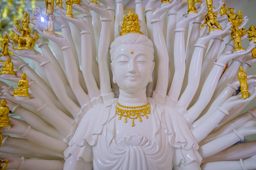 Nakhon Pathom,Thailand - November 6 ,2016 :  White Guan Yin sculpture thousand Hand  in Wat Sri maha pho Temple (ancient Temple)in Nakhon Pathom,Thailand . Photo taken on: 6 November , 2016