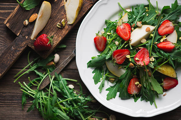 istock Salad with strawberry, arugula and pear 623458394