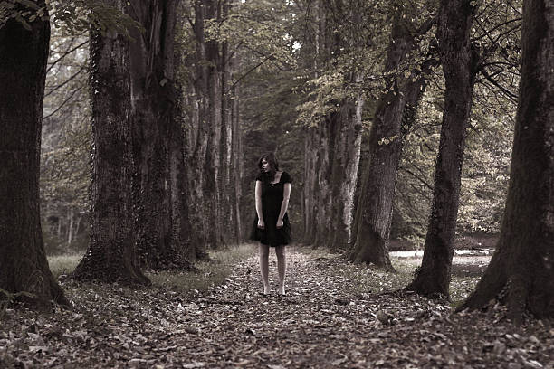 istock The girl in the dark forest 623458944