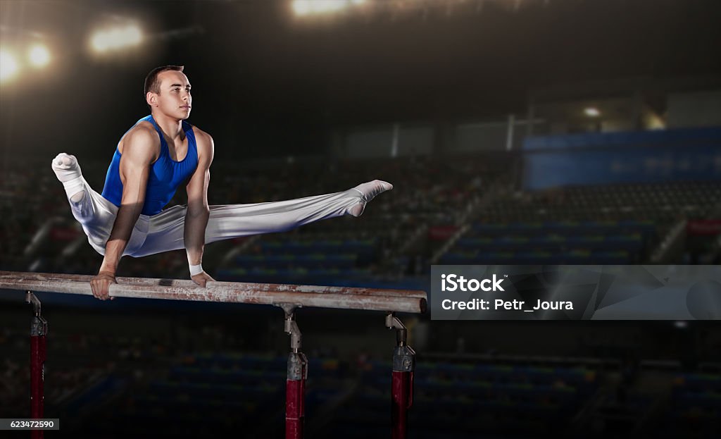 portrait of young man gymnasts portrait of young man gymnasts competing in the stadium Gymnastics Stock Photo