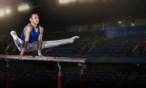 portrait of young man gymnasts portrait of young man gymnasts competing in the stadium gymnastics stock pictures, royalty-free photos & images
