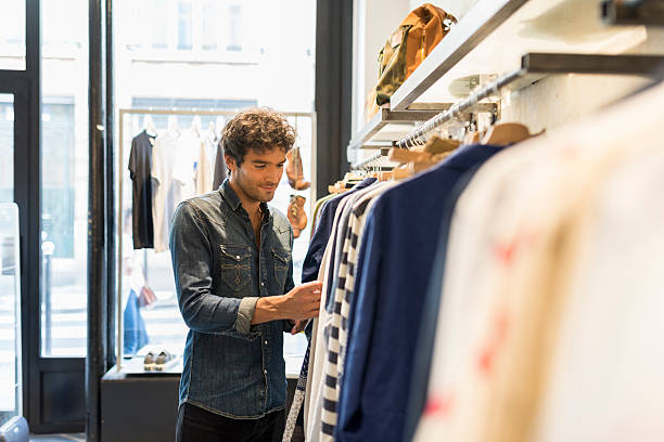 istock Man bought shirt in a fashionable shops 623473900