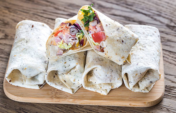istock Chicken burritos on the wooden background 623483722