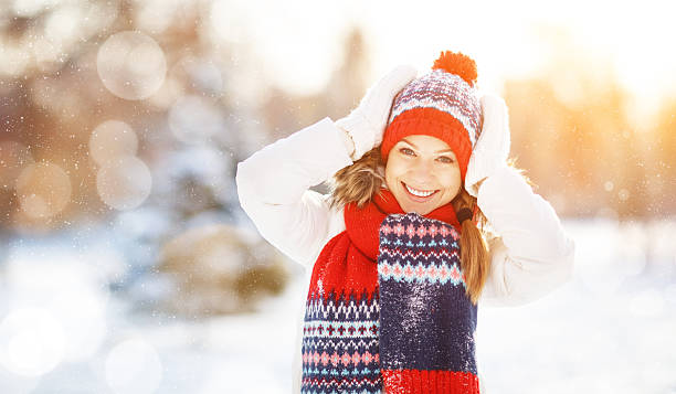 istock happy young woman in winter for a walk 623483860