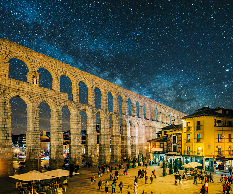 The roman aqueduct in Segovia, Spain, under a starry sky