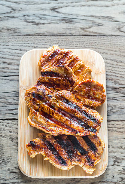 istock Grilled pork steaks on the wooden board 623484562