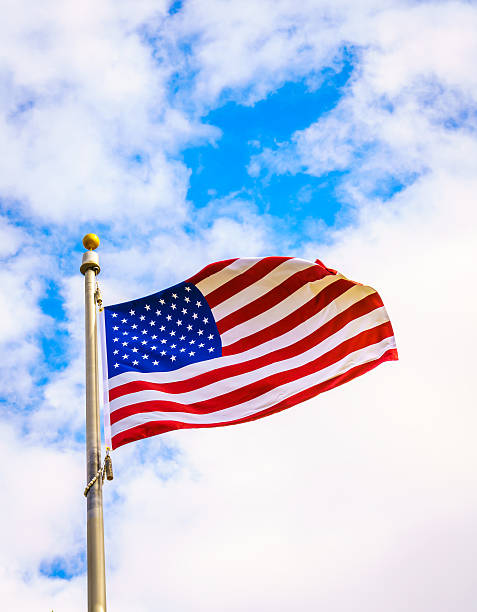 istock Low Angle View Of American Flag Against Cloudy Sky 623484624