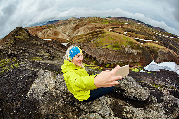 istock woman hiker photographer 623484710