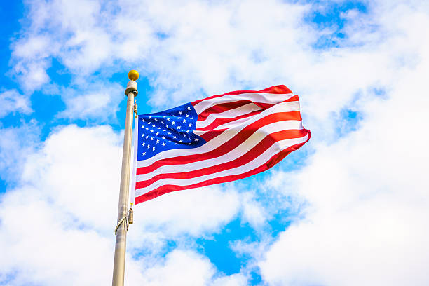 istock Low Angle View Of American Flag Against Cloudy Sky 623487152