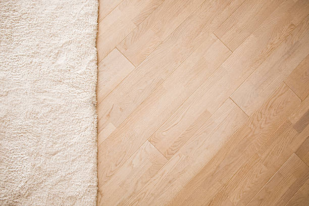istock Laminate parquete floor with beige soft carpet 623487168