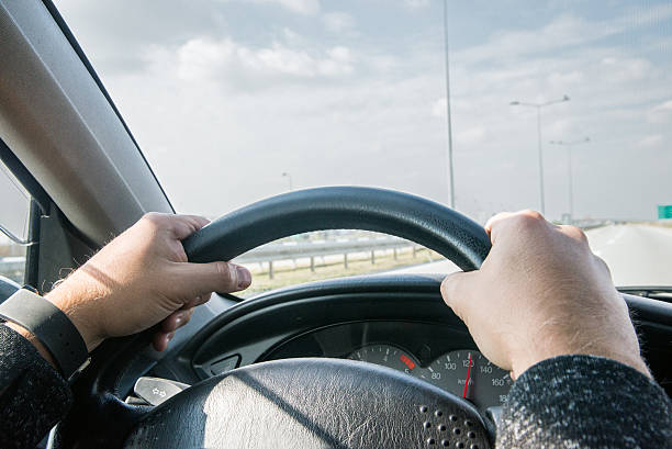 istock Man driving the car on the freeway in Europe 623487462