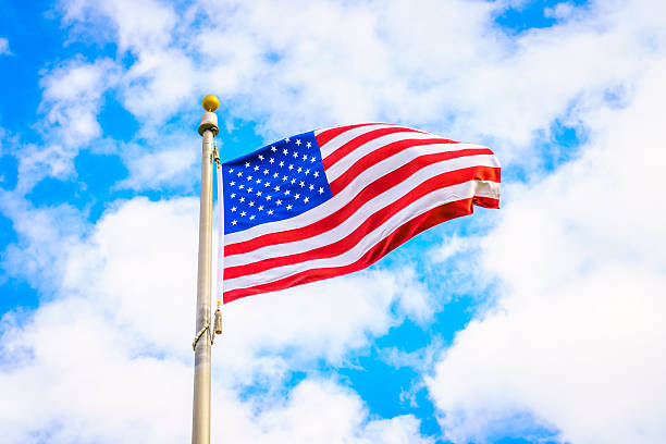 istock Low Angle View Of American Flag Against Cloudy Sky 623488286