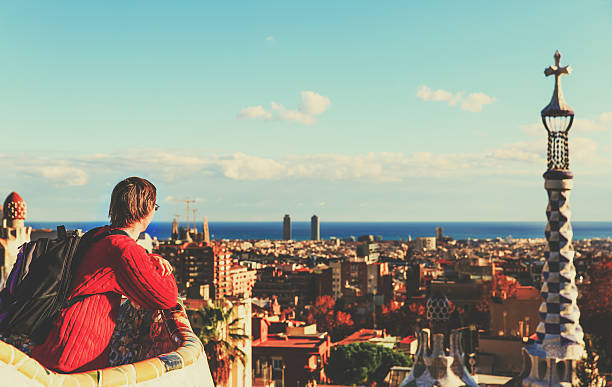 istock young tourist in Park Guell, Barcelona, Spain looking at panoramic 623501366