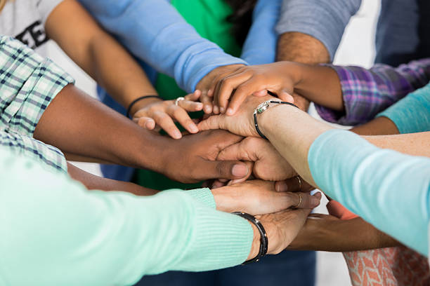 istock Team of people with hands together 623503414