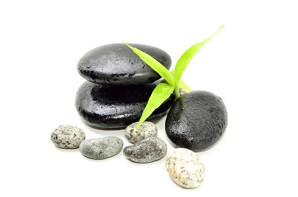 istock Zen stone with bamboo leaf on white background. Spa concept 623505562