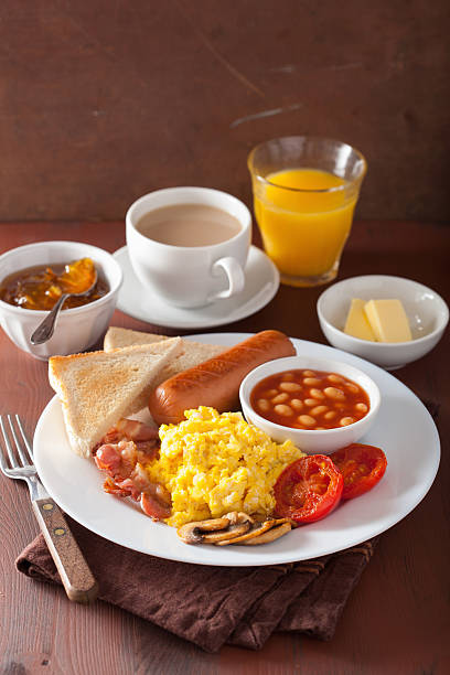 istock full english breakfast with scrambled eggs, bacon, sausage, bean 623506416