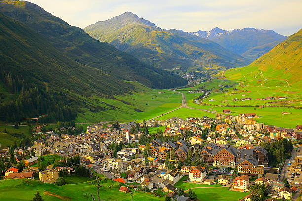 Above Andermatt alpine village panorama from Oberalp Pass, Swiss Alps Above Andermatt panorama and Furka pass from Oberalp Pass, Swiss Alps lepontine alps stock pictures, royalty-free photos & images