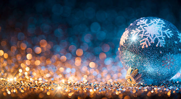 istock Christmas ornament on defocused lights. Decorations Bokeh Blue Gold 623509304