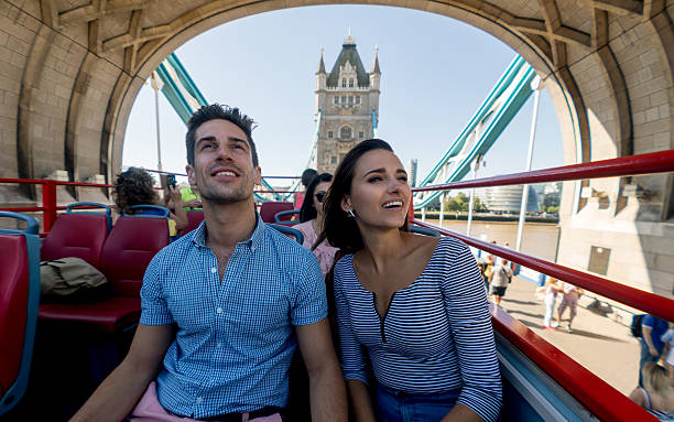 happy couple on a tour bus - women travel destinations london england tourist imagens e fotografias de stock