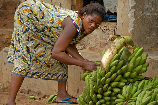 Kampala, Uganda-11 April 2017. The way people life in Uganda. Woman is selling bananas in her township.