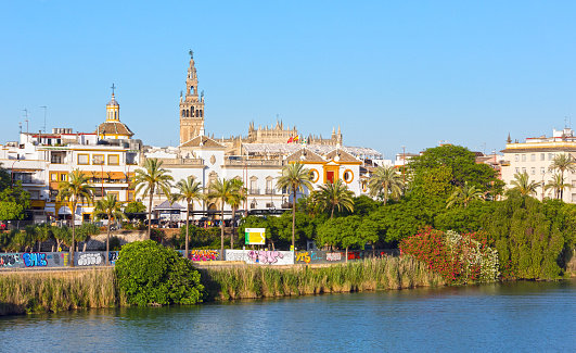 Seville, Spain - May 26, 2016: Evening summer Seville city view with Guadalquivir river (Spain).