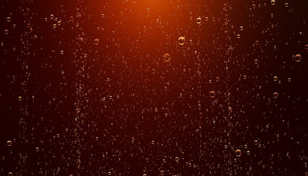 Sparkling Cola Bubbles High quality 3D render of sparkling cola bubbles. Cola bubles are moving on a dark amber background. Horizontal composition with copy space. Luxury concept. Great use as a background for beverages and soft drinks related concepts. cola stock pictures, royalty-free photos & images