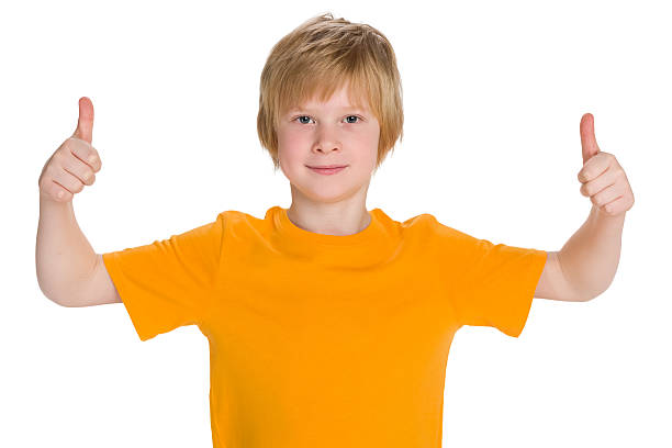 istock Smiling boy holds his thumbs up 623519880