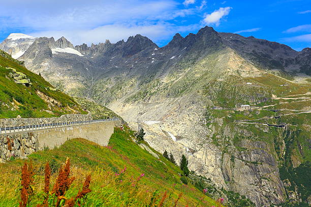 Furka landscape from Grimsel Mountain pass, Road crossing swiss alps Furka pass alpine landscape from Grimsel Mountain pass, Road crossing swiss alps grimsel pass photos stock pictures, royalty-free photos & images