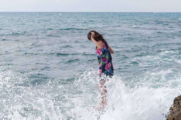 istock Young woman walking  at the beach 623520774