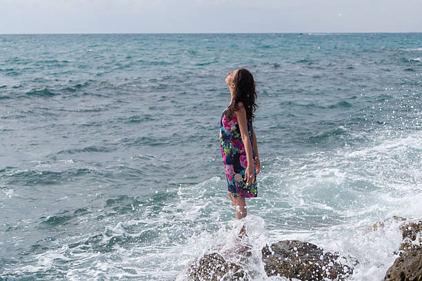 istock Young woman walking  at the beach 623521784