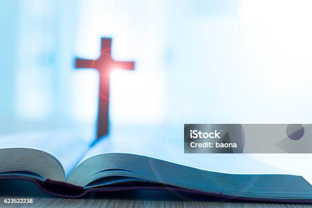 Bible And Cross On Desk Stock Photo - Download Image Now - Bible, Religious Cross, Cross Shape