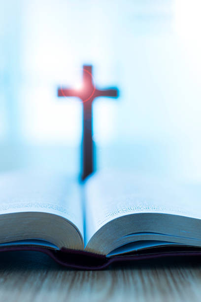 istock Bible and cross on desk 623522316