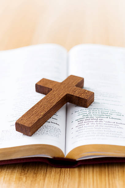 istock Bible and cross on desk 623522654