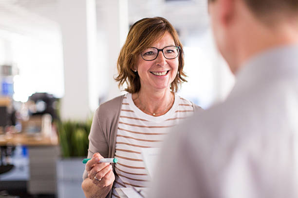 istock Woman boss speaking with her colleague 623524380