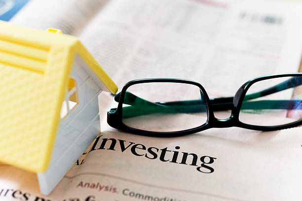 istock Coins on financial newspapers 623527224