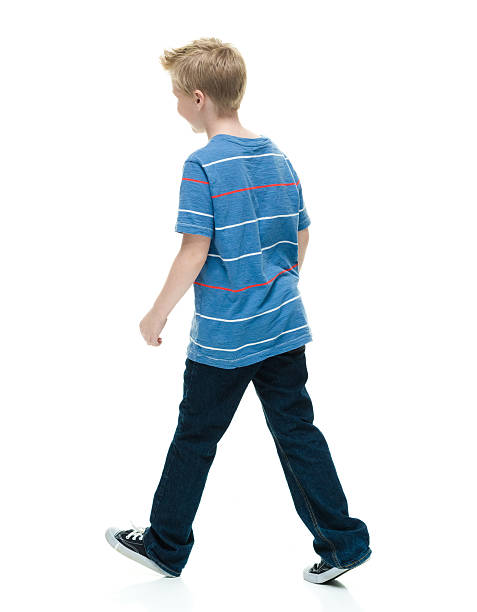 istock Rear view of little boy walking 623528142