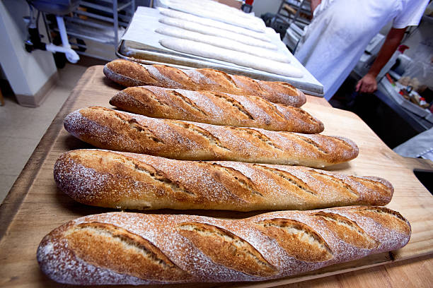 Close  View  Row of Freshly Baked Bread Baguette Loaves