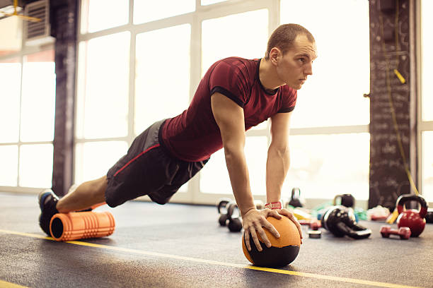 istock Exercising with foam roller in the gym 623532820