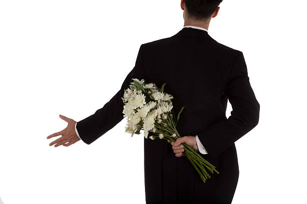 istock Man in tuxedo with flowers 623534326
