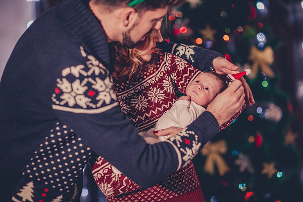 istock Family decorating a Christmas tree 623534392
