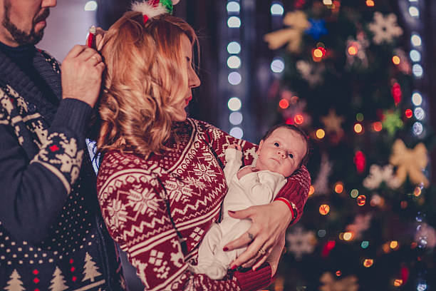 istock Family decorating a Christmas tree 623535432