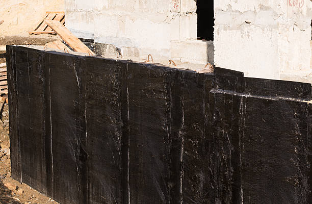 Waterproofing basement and foundations stock photo