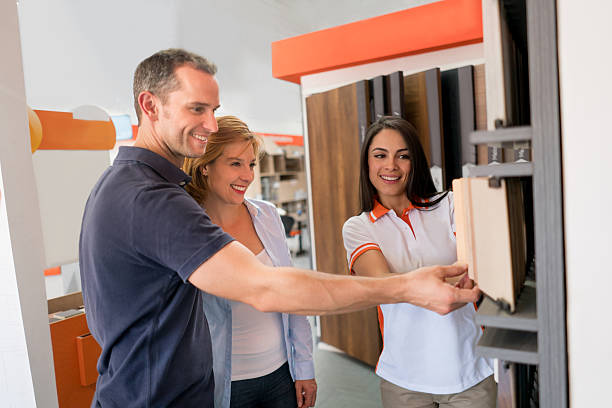 istock Couple remodeling their house and looking at floor samples 623536408