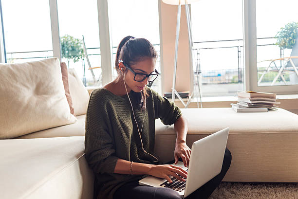 istock woman working on her laptop at home 623537490