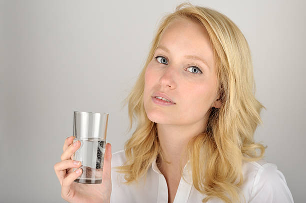 istock Water glass and woman 623537622