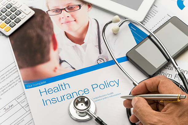 istock Health Insurance Policy brochure with paperwork. 623539096