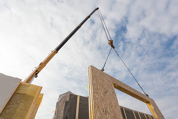 roofer builder worker with crane installing structural insulated panels sip. - subcontractor imagens e fotografias de stock