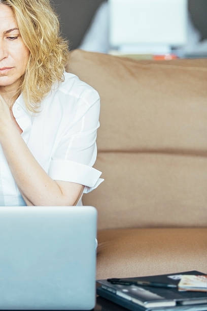istock Half face of woman working on laptop 623585954