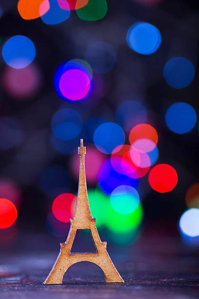 istock Wooden Eiffel Tower with garland lights on colorful bokeh background 623592728