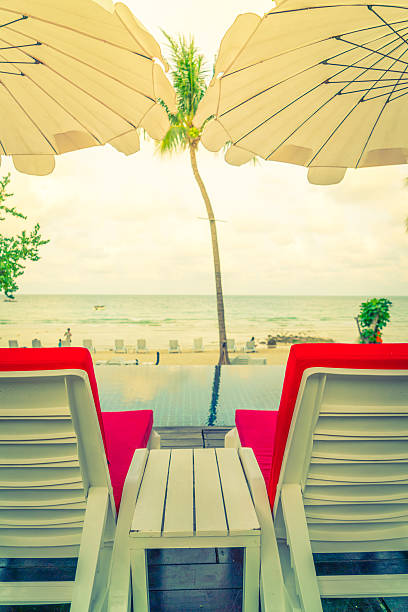 istock Deck chair with parasol near the beach 623594056